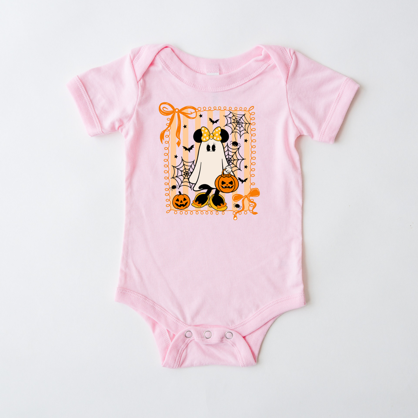 Pink baby onesie with Halloween-themed design on a white background