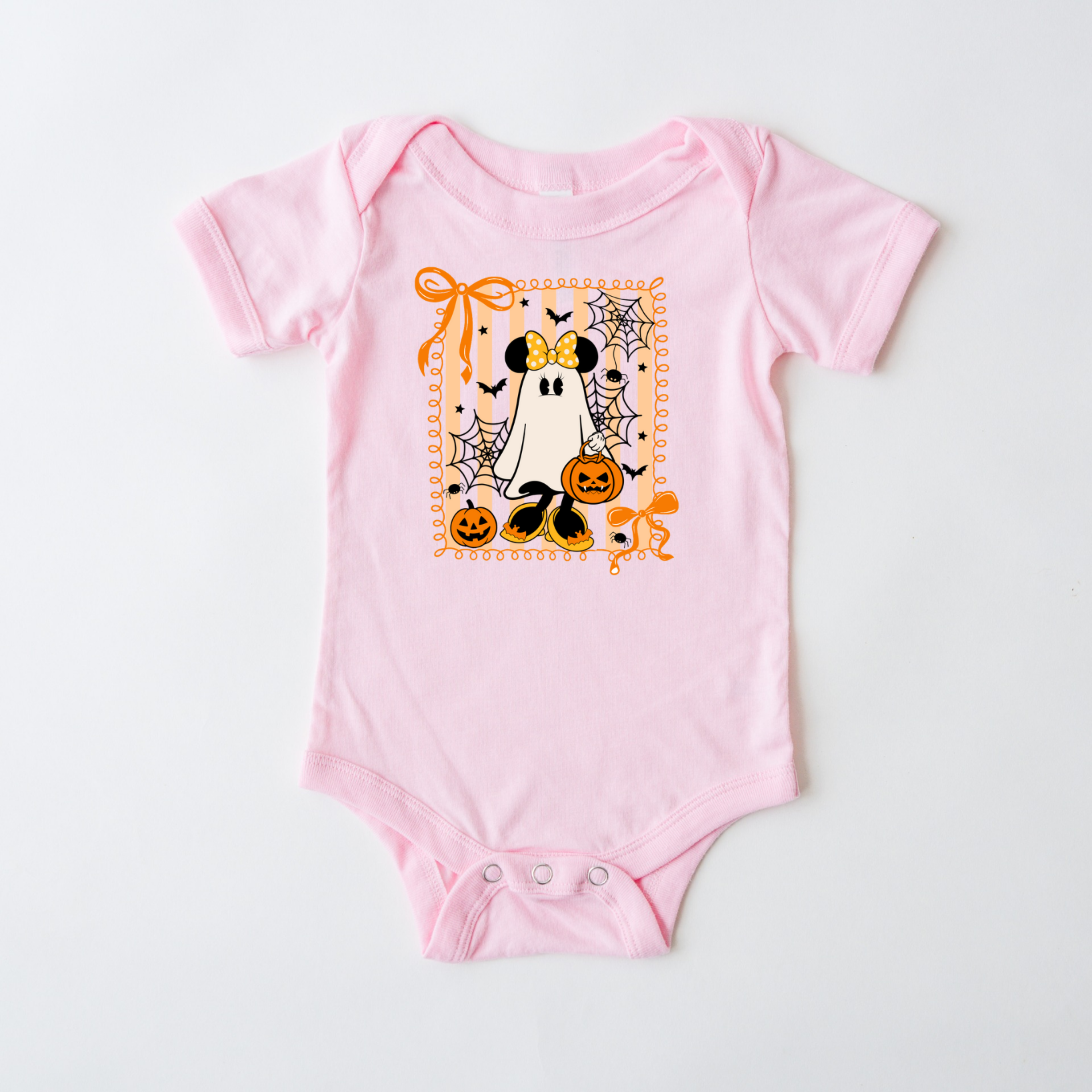 Pink baby onesie with Halloween-themed design on a white background