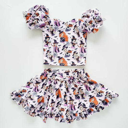 Halloween-themed children's outfit with top and skirt on a white background