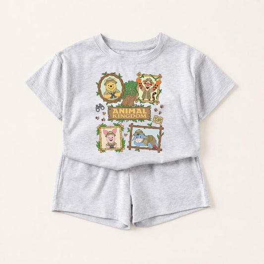 Honey Animal Kingdom two-piece set: light gray top and shorts with Winnie the Pooh, Tigger, Piglet, and Eeyore safari graphics.