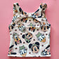 Kids' pink activewear top with The, The, Ducky, Daisy, and Doggy safari print and back cutout.