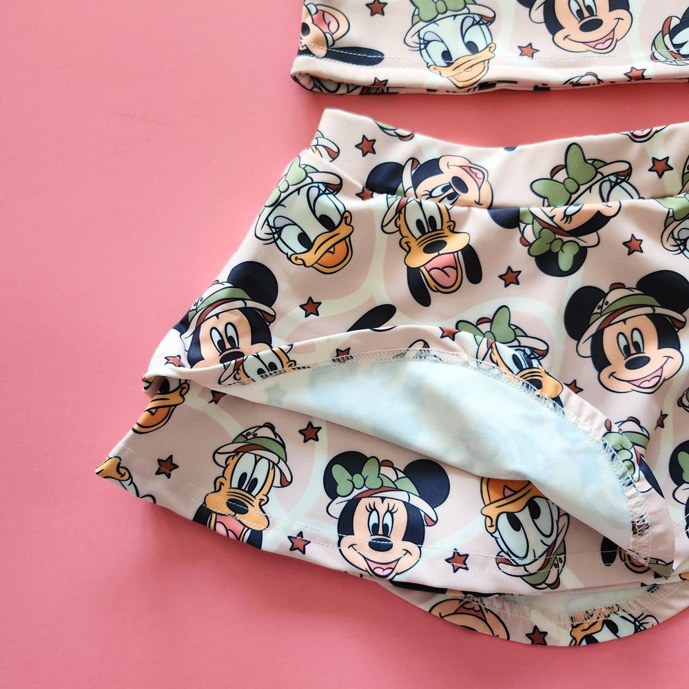 Kids' pink safari activewear set with The, The, Ducky, and Doggy characters.