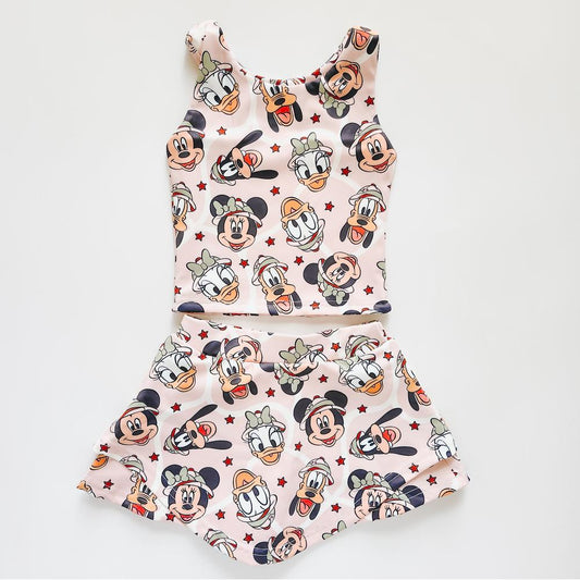 Kids' pink activewear two-piece with The, The, Ducky, and Pluto safari print.