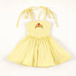 Yellow Beauty Twirl Athleticwear Dress with tie straps, white lace trim, and a red rose crown emblem.