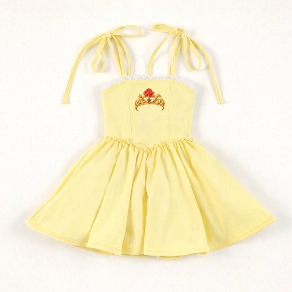Yellow Beauty Twirl Athleticwear Dress with tie straps, white lace trim, and a red rose crown emblem.