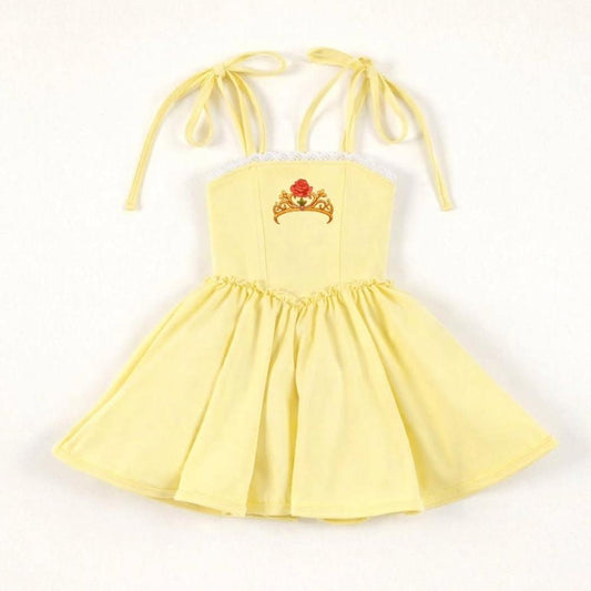 Yellow Beauty Twirl Athleticwear Dress with tie straps, white lace trim, and a red rose crown emblem.