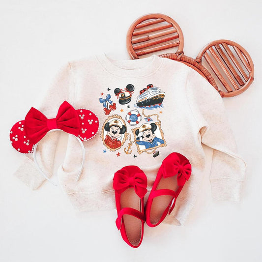 Cream crewneck sweater with The & The cruise designs, red The ears, and red bow shoes.