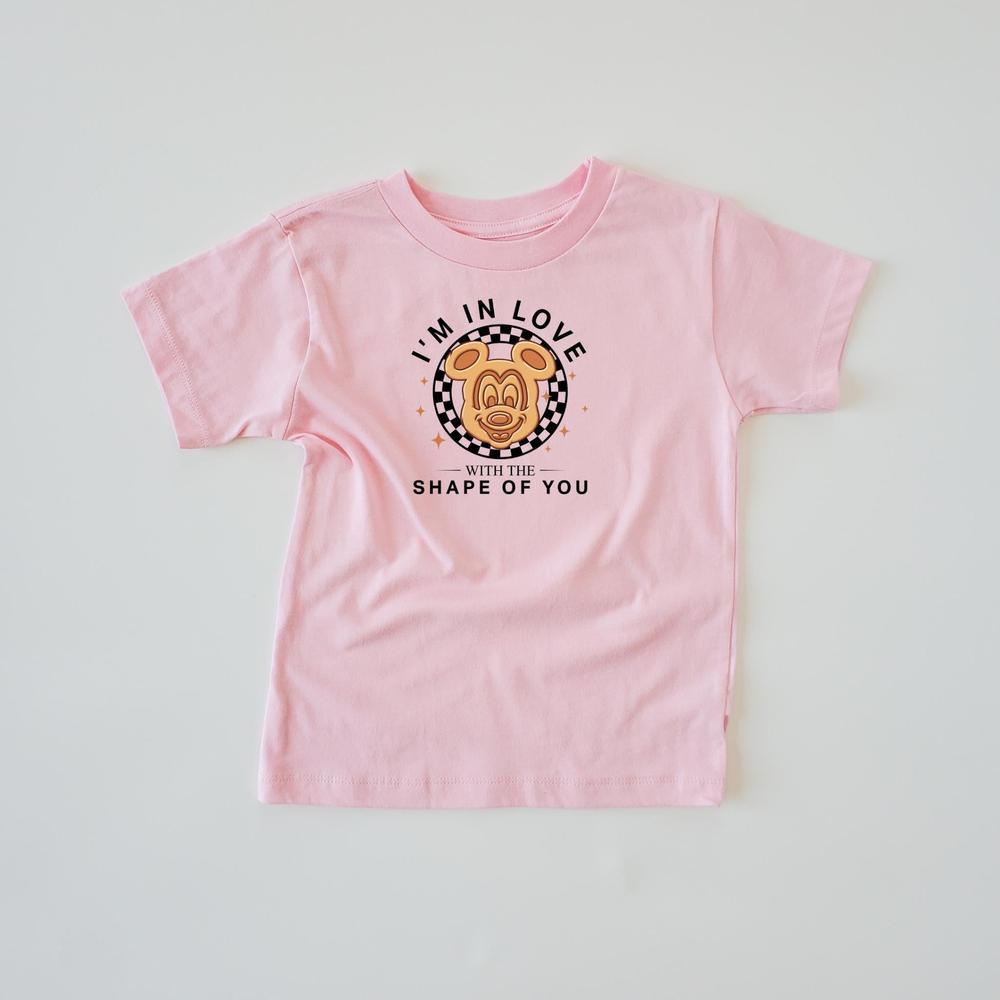 Pink kids' cotton t-shirt with "I'm In Love With The Shape Of You" text and a The Mouse head design.