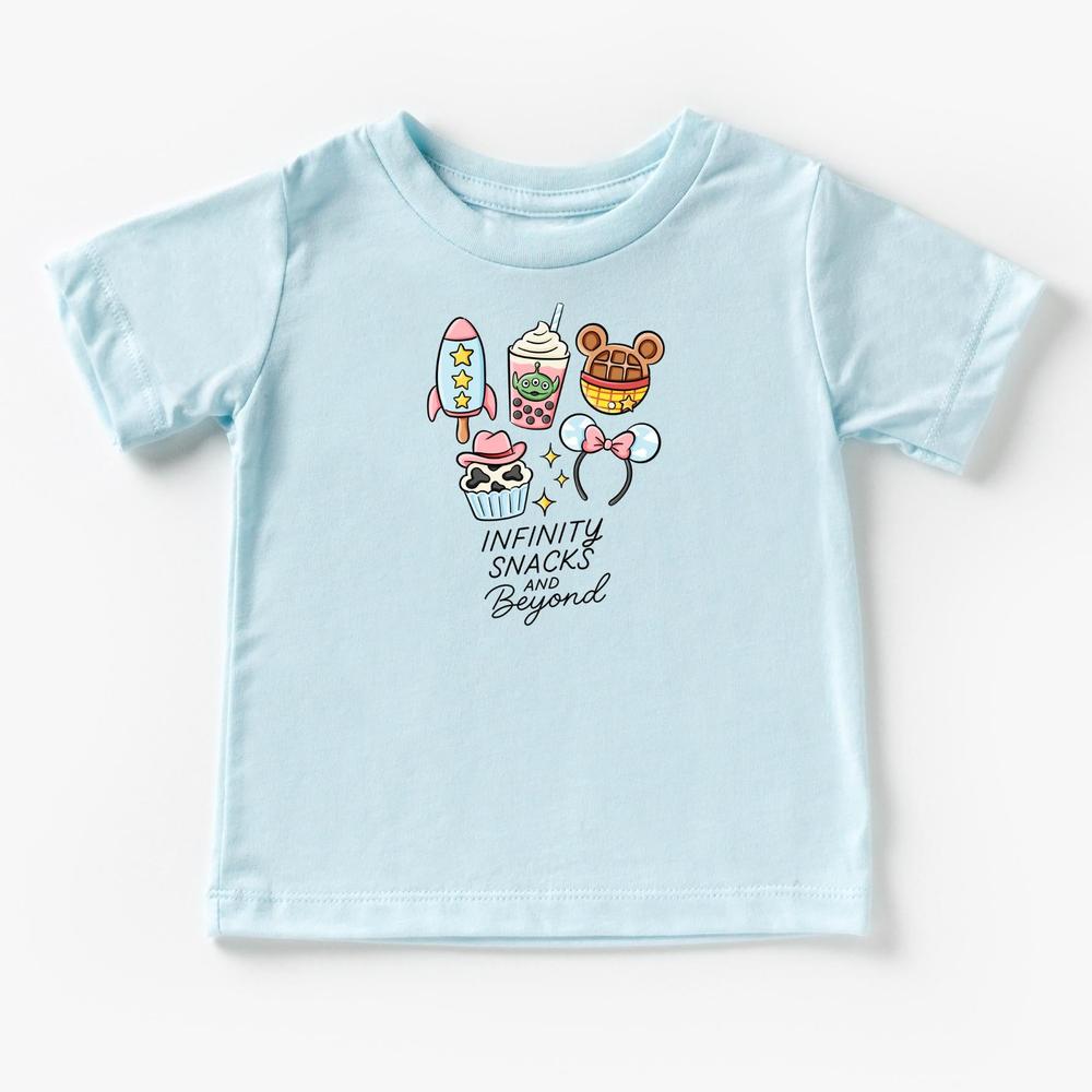 Light blue cotton kids t-shirt with "Infinity Snacks and Beyond" text and cartoon snacks like a rocket, drink, waffle, cupcake, and The ears.