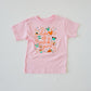 Pink short-sleeve t-shirt with "Life of a Park Girl" text and colorful park-themed icons.