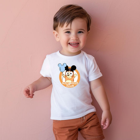 Toddler boy in white Magical Bingo Boys T-shirt with blue balloon design.