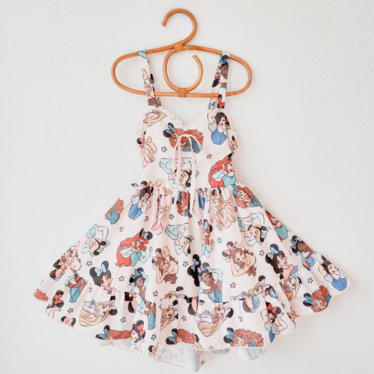 Magical Day Sundress: White dress with The Park princesses, criss-cross back, and knee-length skirt.