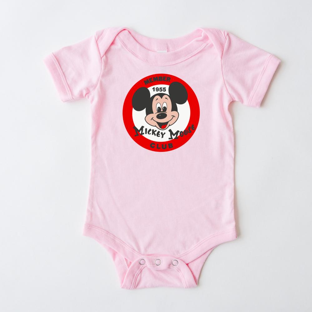 Pink baby bodysuit with a red and white The Mouse Club logo featuring The's face and "Member 1955".