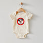 Cream toddler bodysuit with a red and white The Mouse Club logo.