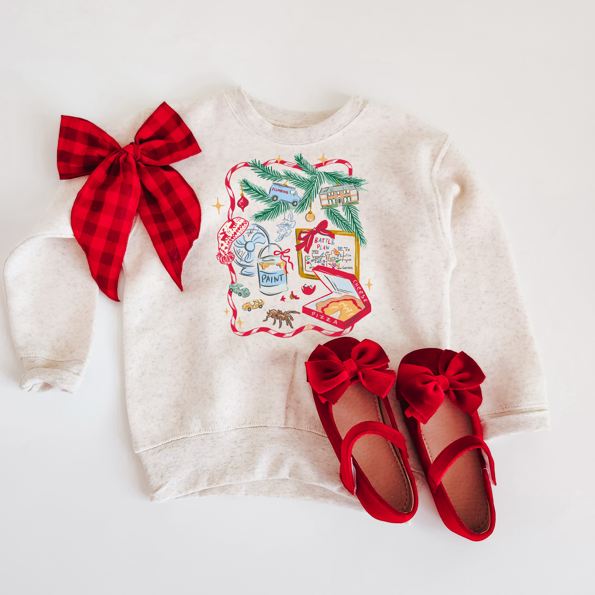 White sweatshirt with Christmas design and red shoes on a white background